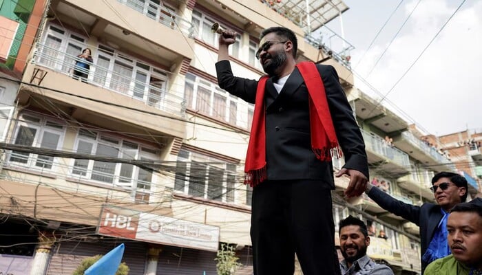 Balendra Shah, a rapper-turned-politician and the prime ministerial candidate for the Rastriya Swatantra Party (RSP), rings a bell, which is the partys symbol, as he takes part in an election campaign in Kirtipur, Kathmandu, Nepal, February 28, 2026. — Reuters