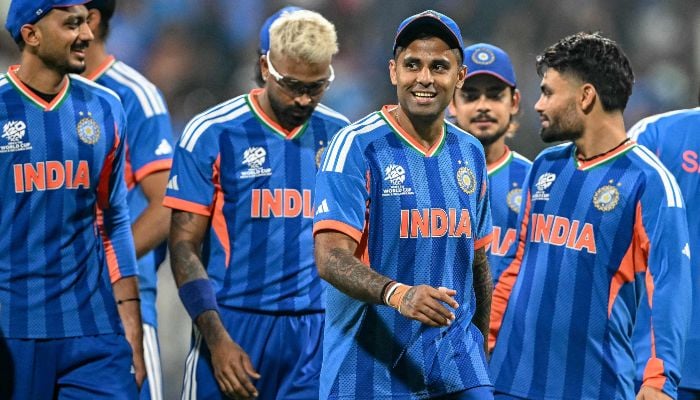 Indias captain Suryakumar Yadav (C) and his teammates walk off the field after winning the 2026 ICC Mens T20 Cricket World Cup group stage match against USA at the Wankhede Stadium in Mumbai on February 7, 2026. — AFP
