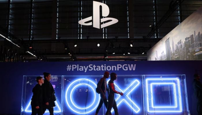 Cosplayers dressed as Spider-Man walk in front of the PlayStation stand at the Paris Games Week (PGW), a trade fair for video games in Paris, France, November 5, 2023. — Reuters