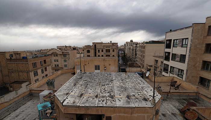 The roof of a house is seen covered with soot after overnight strike on the Tehran Oil Refinery in Tehran on March 8, 2026.