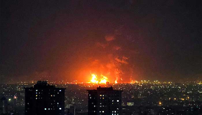 Explosions erupt following strikes at Tehran Oil Refinery in Tehran on March 7, 2026. — AFP