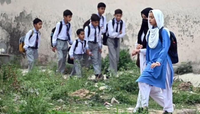 Students can be seen on their way to school as educational institutions in Islamabad on May 8, 2025. — APP