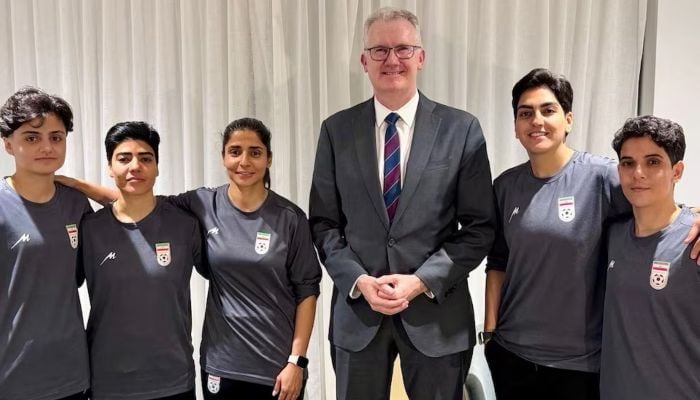 Australia’s Home Affairs Minister Tony Burke poses with Fatemeh Pasandideh, Mona Hamoudi, Atefeh Ramezanizadeh, Zahra Ghanbari and Zahra Sarbali, the five women from the Iranian women’s soccer team who were granted humanitarian visas, in Queensland, Australia, March 9, 2026. — X/@Tony_Burke