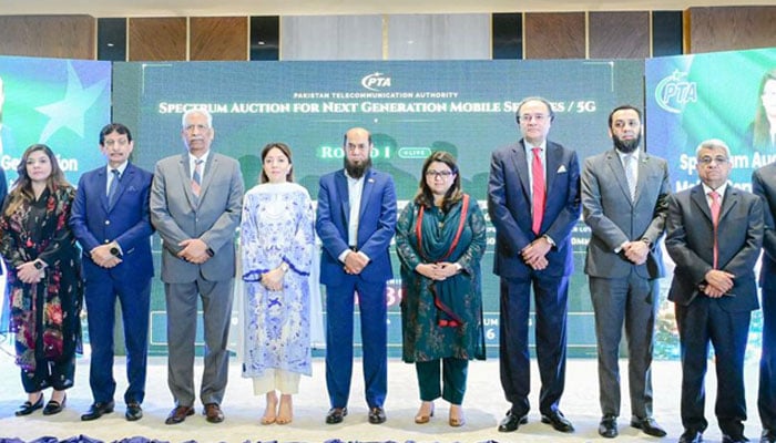Federal ministers and other officials pose for a group photo at the opening ceremony of the Spectrum Auction for Next Generation Mobile Services in Islamabad on March 10, 2026. — X@MoitOfficial