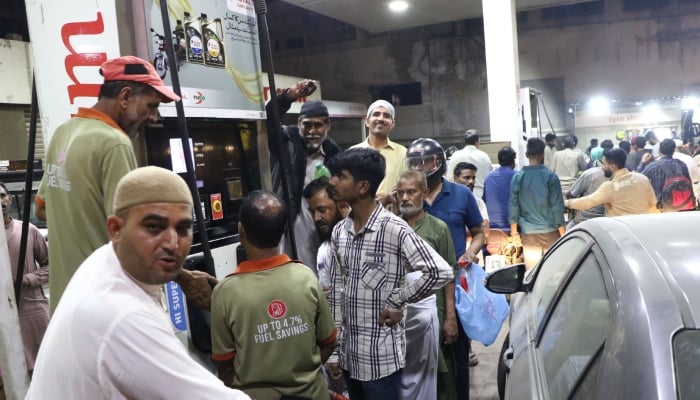 People gathered at a petrol pump station for purchase petrol in Karachi, March 6, 2026. — Online