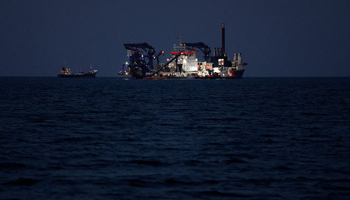 The Artemis dredger operated by Van Oord sits anchored as the traffic is down in the Strait of Hormuz, amid the U.S.-Israeli conflict with Iran, in Muscat, Oman, March 10, 2026. — Reuters