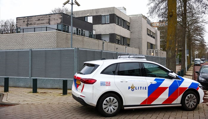 A police vehicle outside a Jewish school following an explosion that caused minor damages, in Amsterdam, Netherlands, March 14, 2026. — Reuters