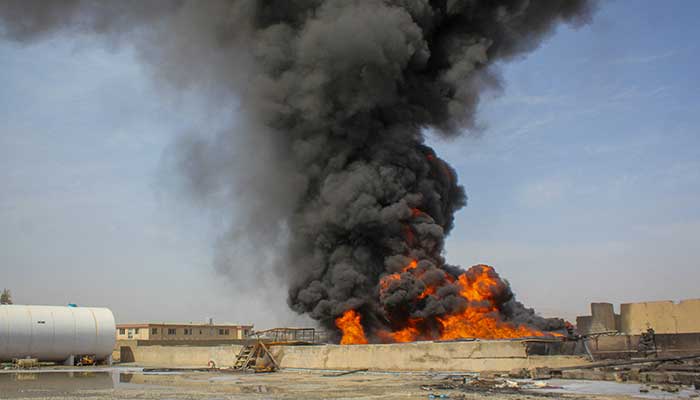 Thick black smoke rises at the private airline Kam Airs fuel depot in Kandahar, Afghanistan, March 13, 2026. — Reuters