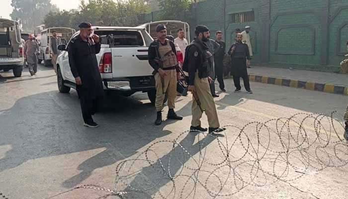 A representational image showing policemen standing guard outside CTD police station in Peshawar on November 2, 2025. — Geo News/Abubakar Saddiq/File