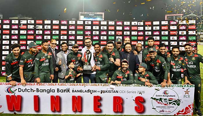 Bangladeshs cricketers and support staff pose with the tournament trophy after the third one-day international (ODI) cricket match between Bangladesh and Pakistan at Sher-e-Bangla National Stadium in Mirpur on March 15, 2026. — AFP