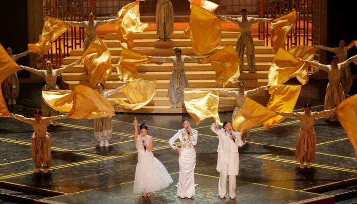 Rei Ami, EJAE, and Audrey Nuna from KPop Demon Hunters perform on stage. — Reuters