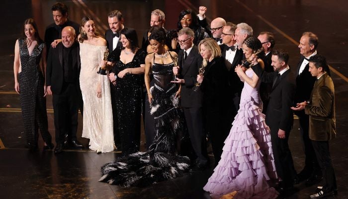 (L-R) Alana Haim, Benicio del Toro, Jose Antonio Garci­a, Florencia Martin, Leonardo DiCaprio, Cassandra Kulukundis, Teyana Taylor, Shayna McHale AKA Junglepussy, Paul Thomas Anderson, Sara Murphy, Michael Bauman, Anthony Carlino, Will Weiske, Chase Infiniti, Andy Jurgensen, Christopher Scarabosio, and Tony Villaflor accept the Best Picture award for One Battle After Another onstage during the 98th Oscars at Dolby Theatre on March 15, 2026 in Hollywood, California, US. — AFP