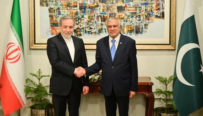 Deputy Prime Minister and Foreign Minister Ishaq Dar shakes hands with Irans Foreign Minister Abbas Araghchi upon his arrival in Islamabad, May 5, 2025. — Reuters