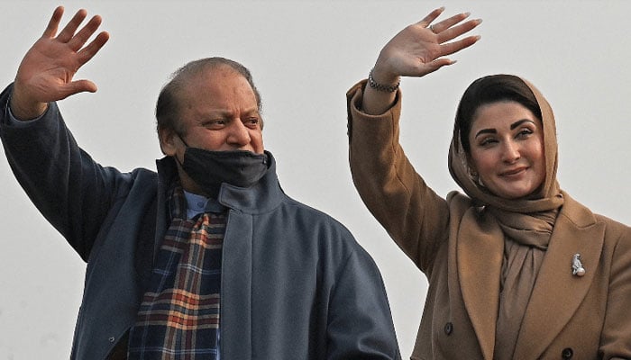 Former premier Nawaz Sharif (left) and his daughter Maryam Nawaz wave to their supporters during a rally in Khyber Pakhtunkhwa on January 22, 2024. — AFP