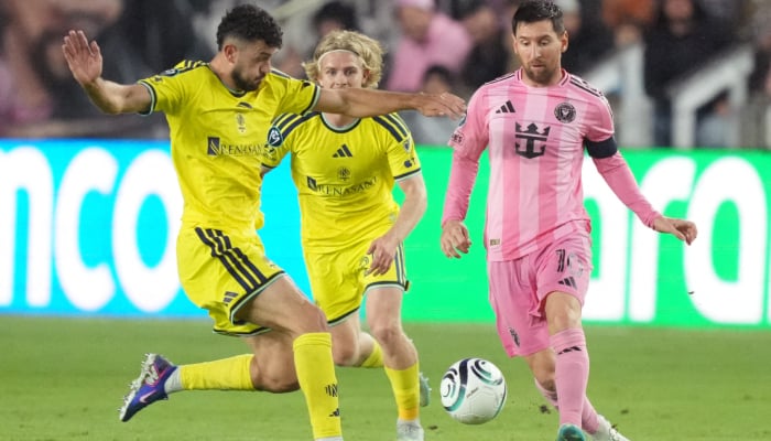 Inter Miami forward Lionel Messi (right) looks to pass the ball as Nashville SC midfielder Patrick Yazbek (left) closes in during the second half at Chase Stadium in Fort Lauderdale, Florida, USA, March 18, 2026. — Reuters