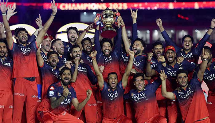 Royal Challengers Bengalurus Rajat Patidar lifts the trophy as he celebrates with teammates after winning the Indian Premier League, June 4, 2025. — Reuters