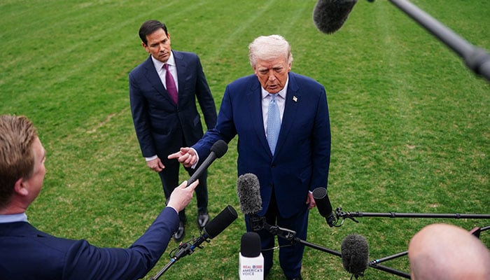 US President Donald Trump speaks to the media, flanked by US Secretary of State Marco Rubio, as he departs the White House for Florida, in Washington, D.C., US, March 20, 2026. — Reuters