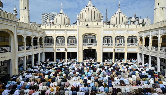 Muslim devotees offer Eid ul Fitr prayers, which marks the end of the Islamic holy fasting month of Ramadan, at a mosque in Karachi on March 21, 2026. — AFP