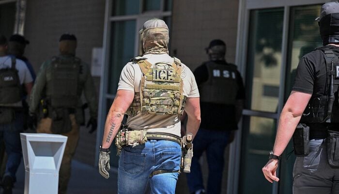 Masked law enforcement officers, including HSI and ICE agents, walk into an immigration court in Phoenix, Arizona, US, May 21, 2025. — Reuters