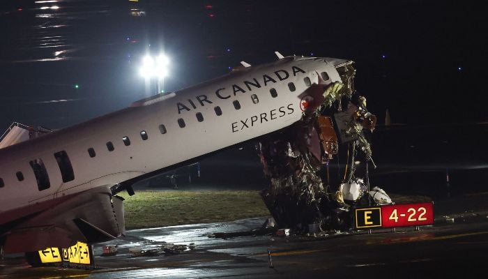 An Air Canada Express CRJ-900 sits on the runway after colliding with a Port Authority fire truck at LaGuardia Airport in New York, on March 23, 2026. — AFP