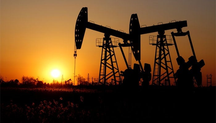 Pumpjacks are seen against the setting sun at the Daqing oil field in Heilongjiang province, China December 7, 2018. — Reuters