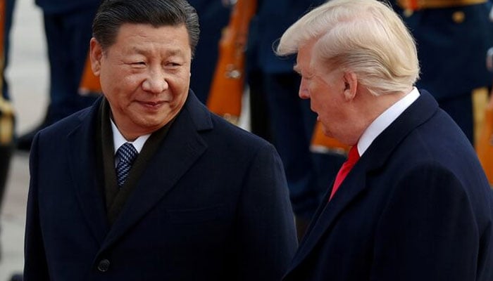 US President Donald Trump takes part in a welcoming ceremony with Chinas President Xi Jinping at the Great Hall of the People in Beijing, China, November 9, 2017. — Reuters
