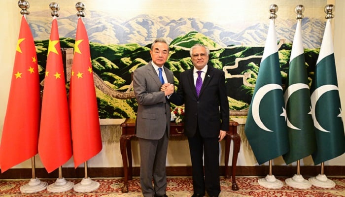 Chinas Foreign Minister, Wang Yi (left), shakes hands with his Pakistani counterpart, Ishaq Dar, at the Ministry of Foreign Affairs in Islamabad, Pakistan, on August 21, 2025. —PID