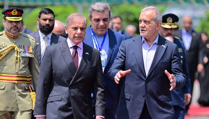 Prime Minister Shehbaz Sharif (right) receives Iranian President Dr Masoud Pezeshkian at the Prime Ministers House, Islamabad, on August 3, 2025. — X/@GovtofPakistan