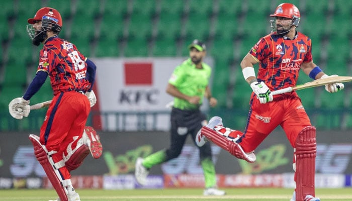 Karachi Kings Muhammad Waseem (right) and Moeen Ali running between wickets during the Pakistan Super League 11 match against Lahore Qalandars at Gaddafi Stadium, Lahore, on March 29, 2026. — PSL
