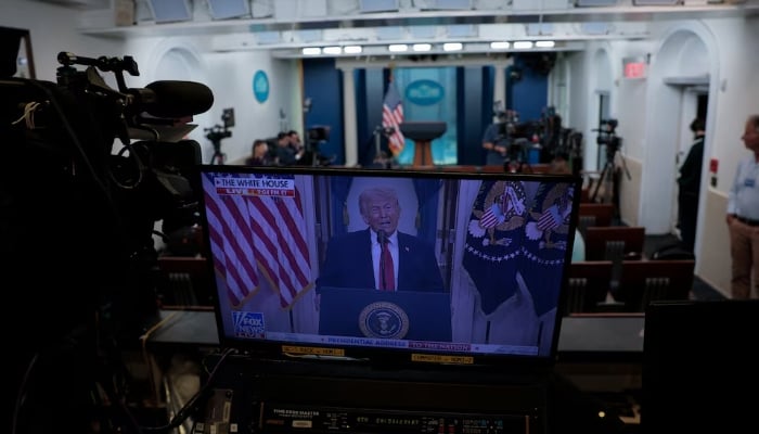 Journalists at the White House listen as US President Donald Trump delivers an address to the nation about the Iran war, in Washington, DC, US, April 1, 2026. — Reuters