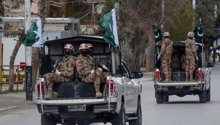 Security personnel patrol with vehicles on a street in Quetta, Balochistan. — AFP/File
