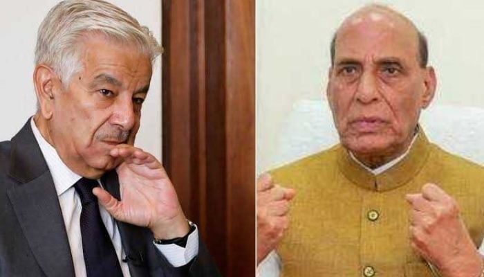 Defence Minister Khawaja Asif (left) and his Indian counterpart Rajnath Singh.  — Reuters