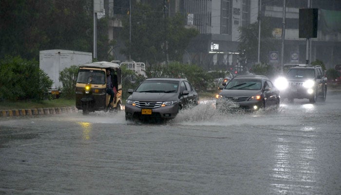 Motorists drive during heavy rainfall in Karachi on April 2, 2026. — ONLINE