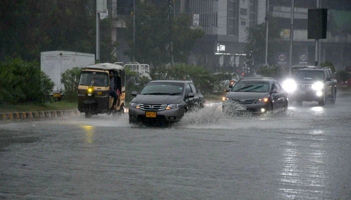 Motorists drive during heavy rainfall in Karachi on April 2, 2026. — ONLINE