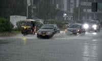 Light showers and strong winds hit Karachi overnight