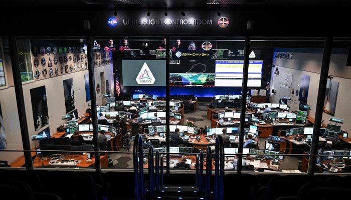 Artemis II controllers monitor the progress of the Orion spacecraft in the White Flight Control Room at Johnson Space Centre in Houston, Texas, on April 3, 2026. — AFP