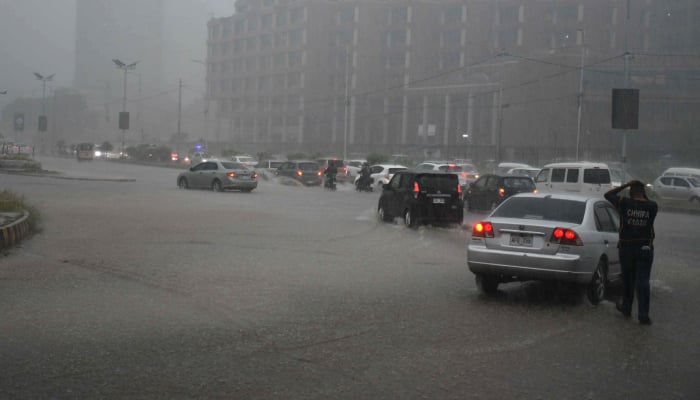 Motorists drive during heavy rainfall in Karachi on April 2, 2026. — Online