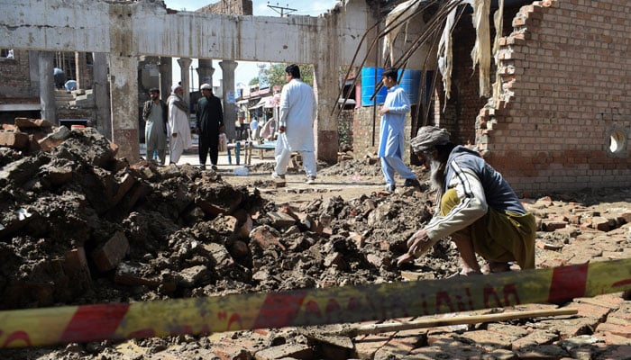 A man clears the rubble of his damaged house, collapsed after heavy rains in Bannu, Khyber Pakhtunkhwa province, March 30, 2026. — Reuters