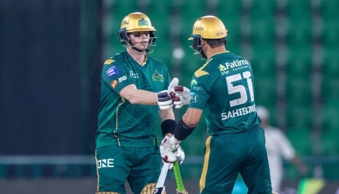 Multan Sultans Steve Smith (left) and Sahibzada Farhan bump fists during their PSL 11 match against Quetta Gladiators at the Gaddafi Stadium in Lahore on April 5, 2026. — PCB