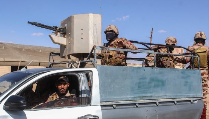Pakistani soldiers patrol at the Pakistan-Afghanistan border in Chaman, Balochistan province on March 19, 2026. — AFP