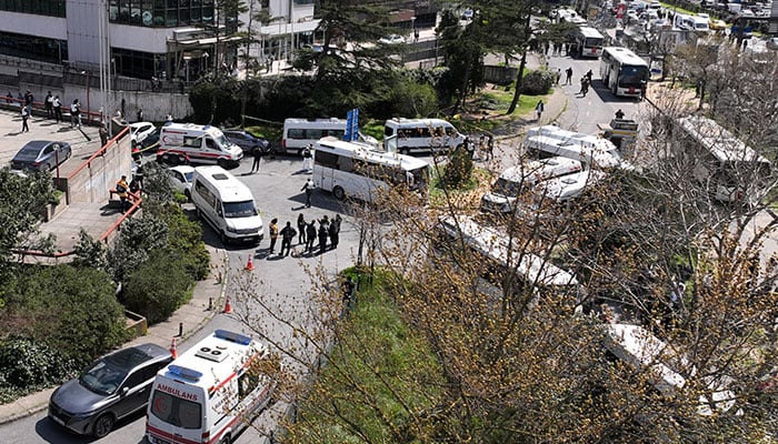 A drone view shows police officers and medics standing at the scene, after a gunfire was heard near the building housing the Israeli consulate, according to a witness, in Istanbul, Turkiye, April 7, 2026. — Reuters