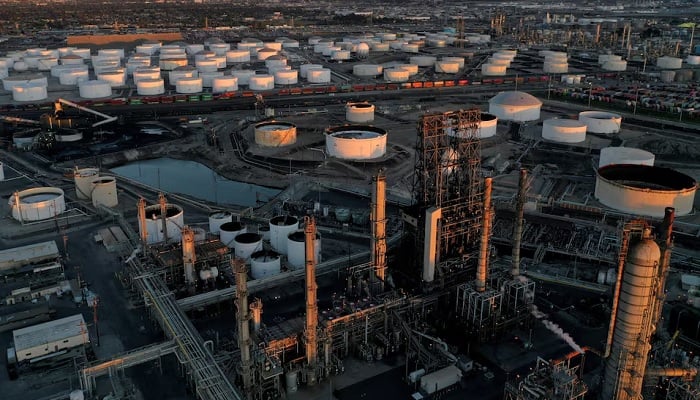 A view of the Phillips 66 Companys Los Angeles Refinery (foreground), which processes domestic & imported crude oil into gasoline, aviation and diesel fuels, and storage tanks for refined petroleum products at the Kinder Morgan Carson Terminal (background) in Carson, California, US, March 11, 2022.— Reuters