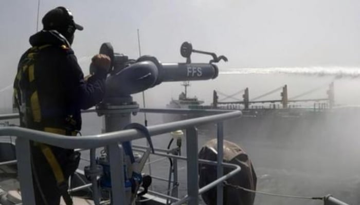 Pakistan Navy personnel take part in firefighting efforts during a search and rescue operation in the North Arabian Sea, April 10, 2026. — ISPR