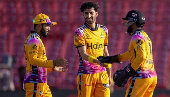 Peshawar Zalmis Sufiyan Muqeem (centre) celebrate with teammates after claiming a wicket during their Pakistan Super League (PSL) 11 match against Lahore Qalandars at the National Bank Stadium in Karachi on April 11, 2026. — PSL