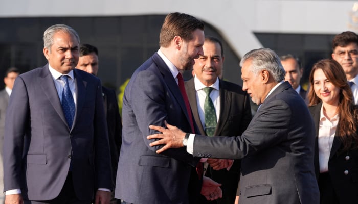 Deputy Prime Minister Ishaq Dar (second right) shakes hands with US Vice President JD Vance he prepares to board Air Force Two, after peace talks with Iran in Islamabad, Pakistan, Sunday, April 12, 2026. — Reuters