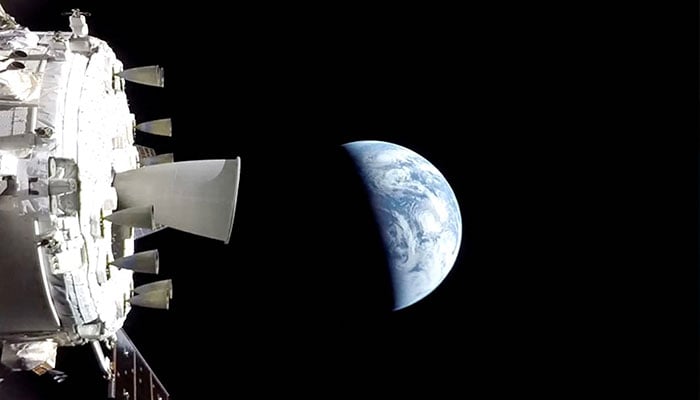 This screengrab from a NASA livestream shows the Orion spacecraft on its way back to the Earth on April 10, 2026. — AFP