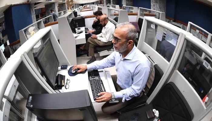 A trader monitors share prices at Pakistan Stock Exchange (PSX) in Karachi, Pakistan, 09 April 2026. — INP