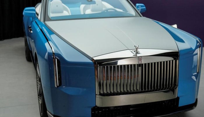 This image shows a new Rolls-Royce electric vehicle being unveiled at the Goodwood plant, with production limited to 100 cars. — AFP