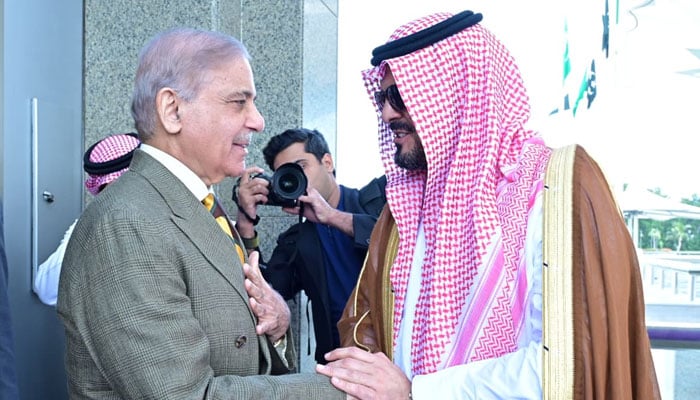 Makkah Region Deputy Governor Prince Saud bin Mashaal bin Abdulaziz (left) welcomes Prime Minister Shehbaz Sharif upon his arrival at King Abdulaziz International Airport in Jeddah on April 15, 2026. — PMO