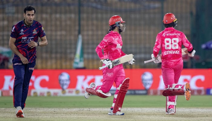 Islamabad Uniteds Sameer Minhas (centre) and Devon Conway (right) running between wickets during their PSL match against Karachi Kings at National Bank Stadium, Karachi, on April 16, 2026. — PSL
